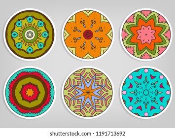 Decorative round ornaments set, isolated elements. Colorful mandala, stylized flower. Abstract geometric doodle patterns for plate decoration, fabric print,  business or greeting card design