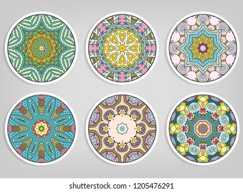 Decorative round ornaments set, isolated elements. Colorful mandala, stylized flower. Abstract geometric doodle patterns for plate decoration, fabric print,  business or greeting card design