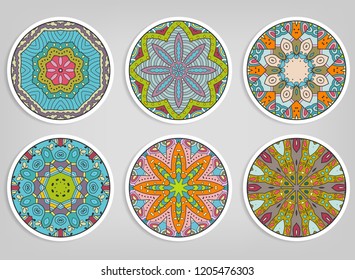 Decorative round ornaments set, isolated elements. Colorful mandala, stylized flower. Abstract geometric doodle patterns for plate decoration, fabric print,  business or greeting card design