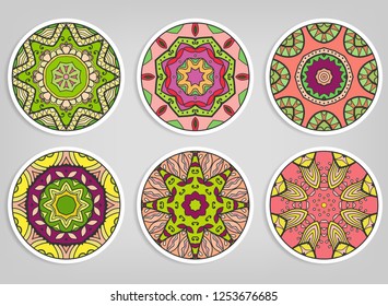 Decorative round ornaments set, isolated elements. Colorful mandala, stylized flower. Abstract geometric doodle patterns for plate decoration, fabric print,  business or greeting card design