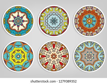 Decorative round ornaments set, isolated elements. Colorful mandala, stylized flower. Abstract geometric doodle patterns for plate decoration, fabric print,  business or greeting card design