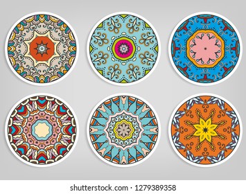 Decorative round ornaments set, isolated elements. Colorful mandala, stylized flower. Abstract geometric doodle patterns for plate decoration, fabric print,  business or greeting card design
