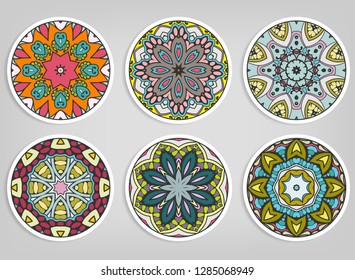 Decorative round ornaments set, isolated elements. Colorful mandala, stylized flower. Abstract geometric doodle patterns for plate decoration, fabric print,  business or greeting card design