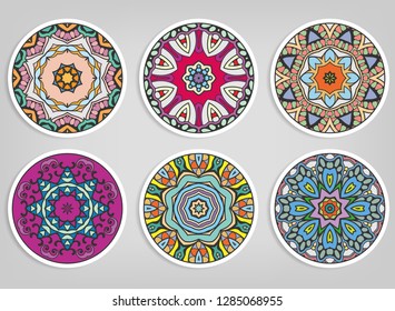 Decorative round ornaments set, isolated elements. Colorful mandala, stylized flower. Abstract geometric doodle patterns for plate decoration, fabric print,  business or greeting card design