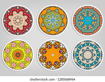 Decorative round ornaments set, isolated elements. Colorful mandala, stylized flower. Abstract geometric doodle patterns for plate decoration, fabric print,  business or greeting card design