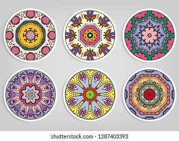 Decorative round ornaments set, isolated elements. Colorful mandala, stylized flower. Abstract geometric doodle patterns for plate decoration, fabric print,  business or greeting card design