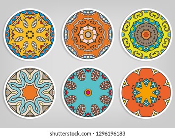 Decorative round ornaments set, isolated elements. Colorful mandala, stylized flower. Abstract geometric doodle patterns for plate decoration, fabric print,  business or greeting card design