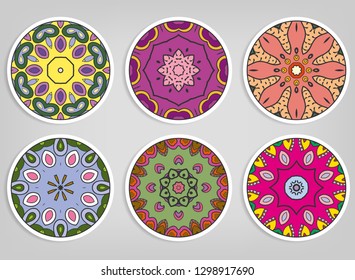 Decorative round ornaments set, isolated elements. Colorful mandala, stylized flower. Abstract geometric doodle patterns for plate decoration, fabric print,  business or greeting card design
