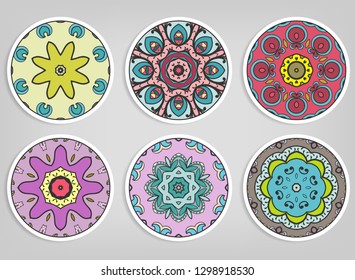 Decorative round ornaments set, isolated elements. Colorful mandala, stylized flower. Abstract geometric doodle patterns for plate decoration, fabric print,  business or greeting card design