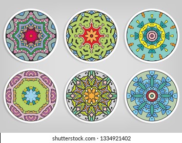 Decorative round ornaments set, isolated elements. Colorful mandala, stylized flower. Abstract geometric doodle patterns for plate decoration, fabric print,  business or greeting card design