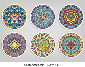 Decorative round ornaments set, isolated elements. Colorful mandala, stylized flower. Abstract geometric doodle patterns for plate decoration, fabric print,  business or greeting card design