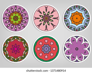 Decorative round ornaments set, isolated elements. Colorful mandala, stylized flower. Abstract geometric doodle patterns for plate decoration, fabric print,  business or greeting card design