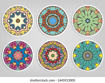 Decorative round ornaments set, isolated elements. Colorful mandala, stylized flower. Abstract geometric doodle patterns for plate decoration, fabric print,  business or greeting card design