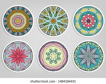 Decorative round ornaments set, isolated elements. Colorful mandala, stylized flower. Abstract geometric doodle patterns for plate decoration, fabric print,  business or greeting card design