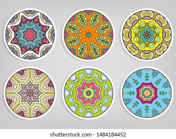 Decorative round ornaments set, isolated elements. Colorful mandala, stylized flower. Abstract geometric doodle patterns for plate decoration, fabric print,  business or greeting card design