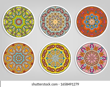Decorative round ornaments set, isolated elements. Colorful mandala, stylized flower. Abstract geometric doodle patterns for plate decoration, fabric print,  business or greeting card design