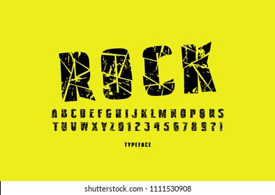 Decorative sans serif font with broken face. Letters and numbers for military, cinema, music logo and title design. Black typeface with rough texture on yellow background