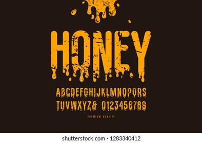 Decorative sans serif font. Letters and numbers with vintage texture for honey logo and label design. Yellow print on black background