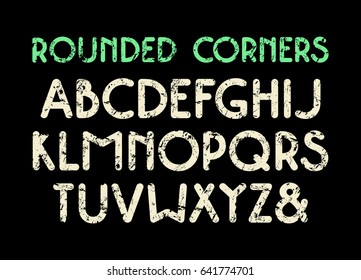Decorative sans serif font with rounded corners. Letters with shabby texture. Print on black background
