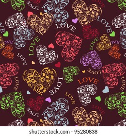 Decorative seamless background with multicolored heart patterns.