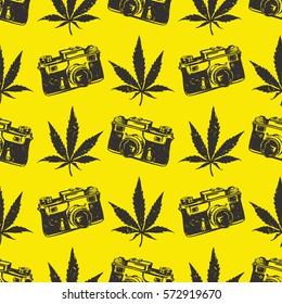 Decorative seamless pattern with black cannabis leaves and old camera on yellow background, wrapping paper. vector illustration