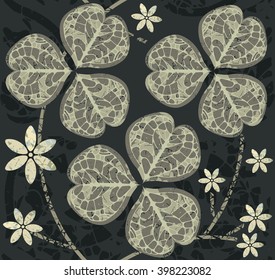 Decorative seamless pattern with clover leaves and flowers for St. Patrick's Day.