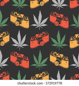 Decorative seamless pattern with color marijuana leaves and old camera on black background, wrapping paper. vector illustration