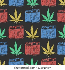 Decorative seamless pattern with color marijuana leaves and old camera on black background, wrapping paper. vector illustration