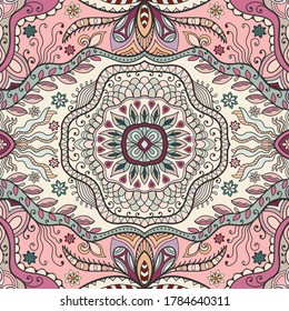 Decorative seamless pattern, colorful doodle background. Hand drawn ethnic ornament with floral and geometric elements. Endless texture for wallpaper, pattern fills, textile fabric or paper print