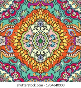 Decorative seamless pattern, colorful doodle background. Hand drawn ethnic ornament with floral and geometric elements. Endless texture for wallpaper, pattern fills, textile fabric or paper print
