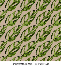 Decorative seamless pattern with doodle monstera leaves ornament. Beige background. Green tropical foliage print. Perfect for fabric design, textile print, wrapping, cover. Vector illustration.