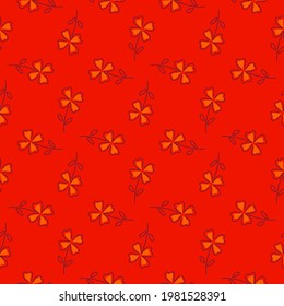 Decorative seamless pattern in geometric style with orange four-leaf clover shapes. Red background. Vector illustration for seasonal textile prints, fabric, banners, backdrops and wallpapers.