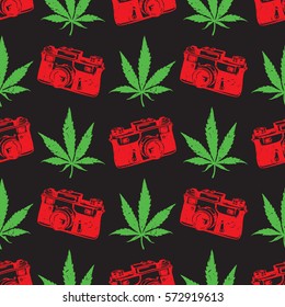 Decorative seamless pattern with green and red marijuana leaves and old camera on black background, wrapping paper. vector illustration