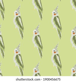 Decorative seamless pattern with grey and green cockatoo shapes print. Light green background. Vector illustration for seasonal textile prints, fabric, banners, backdrops and wallpapers.