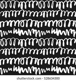 Decorative seamless pattern with handdrawn doodles. Hand painted grungy white lines on black background. Trendy endless texture for digital paper, fabric, decorative backdrops, wrapping
