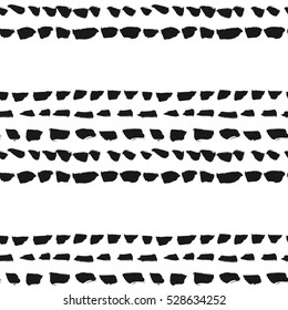 Decorative seamless pattern with handdrawn dotted lines. Hand painted grungy black lines on white background. Trendy endless texture for digital paper, fabric, creative backdrops, wrapping