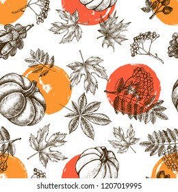 Decorative seamless pattern with Ink hand drawn autumn maple, chestnut, oak leaves, ripe pumpkin and a bunch of rowanberry.  Botanical elements texture for your design. Vector illustration.