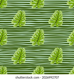 Decorative seamless pattern with jungle green monstera leaf ornament. Striped background. Decorative backdrop for fabric design, textile print, wrapping, cover. Vector illustration.