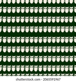 Decorative seamless pattern from owls on a very dark shade of green background. Temptation for fabric design, background, wrapping paper, packaging, covers 