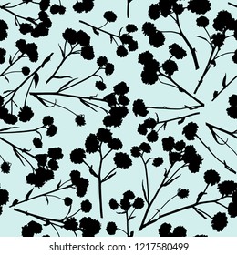 Decorative seamless pattern with silhouettes of small flowers and stems. Endless floral ornament with black chaotic flowers on blue backdrop. Stylish background for fabric, wrapping, decoration.