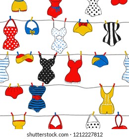 Decorative seamless pattern with swimsuits. Brush painted swimwear, trendy texture. Hand drawn endless stylish backdrop. Colorful beachwear isolated on white background for fabric, wallpaper, wrapping