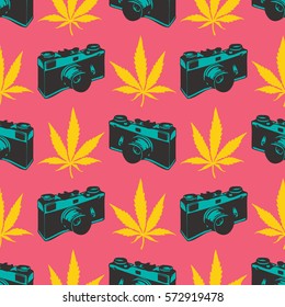 Decorative seamless pattern with yellow marijuana leaves and old camera on pink background, wrapping paper. vector illustration