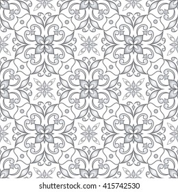 Decorative seamless silver texture on light gray background.  Element for design. Ornamental backdrop. Ornate floral decor for wallpaper. Traditional gray decor on a light gray background.