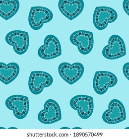 Decorative seamless texture with blue hearts on a light blue background. Colorful vector illustration in doodle style. Symbol of Valentine's Day. For packaging, textiles, wedding cards.