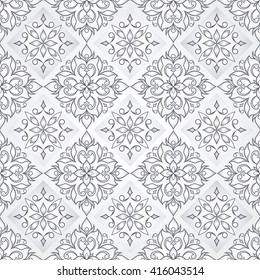 Decorative seamless texture on light gray background.  Element for design. Ornamental backdrop. Ornate floral decor for wallpaper. Traditional gray decor on a light gray background.