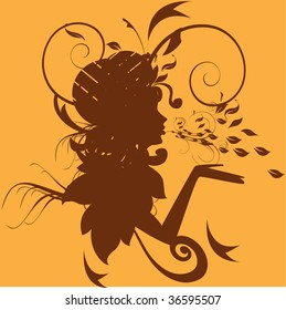 Decorative silhouette of woman with autumn leaves
