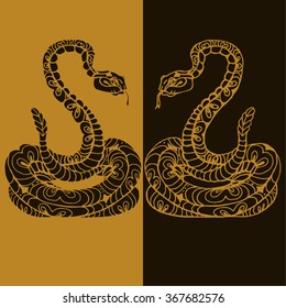 decorative snake, painted by hand. Two reptile yellow on a brown background