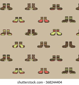 Decorative socks seamless pattern on a beige background. Vector illustration