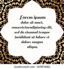 Decorative square element with a gold baroque pattern on a black background.