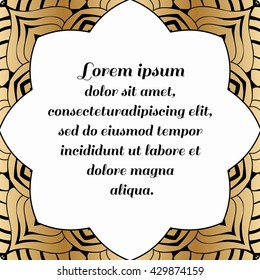 Decorative square element with a gold pattern on a black background.
